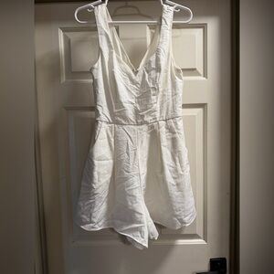 Francesca’s White Sleeveless V-Neck Romper.